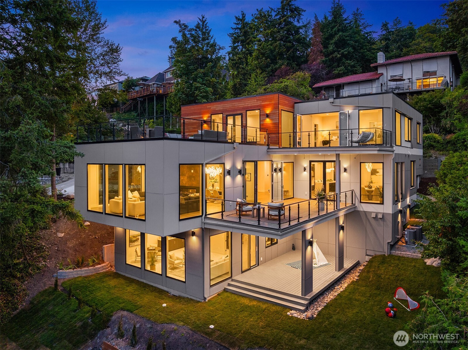Expansive walls of glass and multiple view decks showcase the home’s striking modern design and seamless indoor-outdoor living - 4 entertaining decks - strategically located to take advantage of the views.