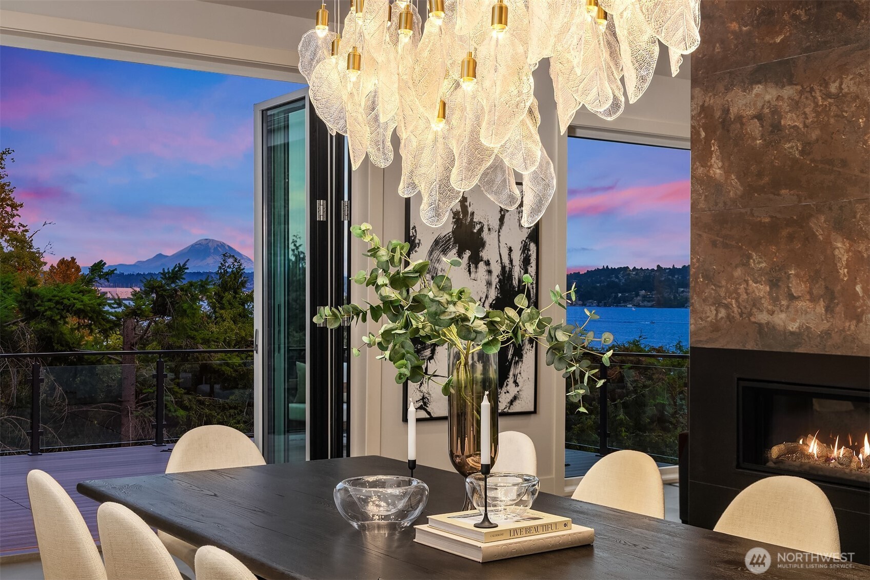 An intimate dining moment where artful lighting meets the beauty of lake and mountain views at dusk.