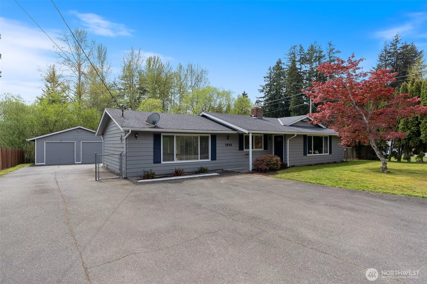 The perfect rambler with a detached garage/shop