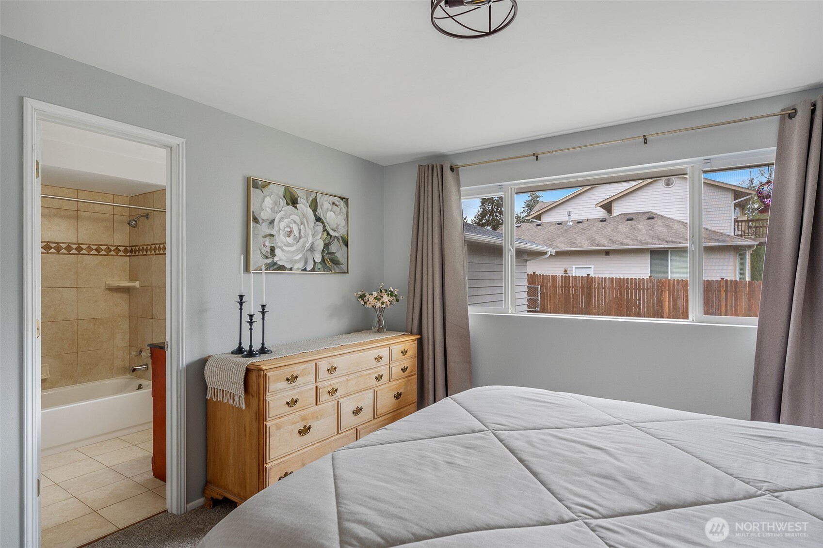 Primary bedroom has dual-access bathroom