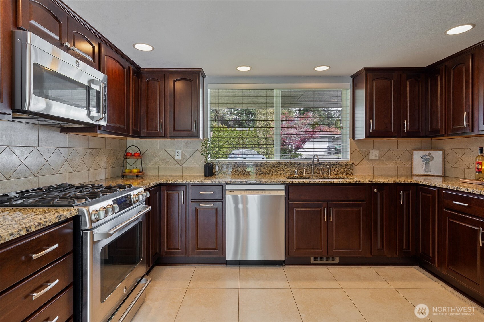 Granite countertops, custom cabinets with pull out shelves and lazy susans above and below.