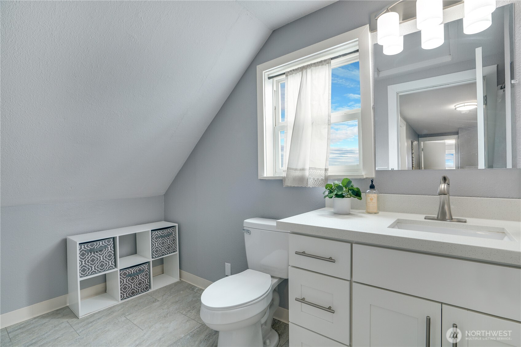 Second-floor ¾ bath with tile flooring, quartz countertops, and space to add a vanity, if desired