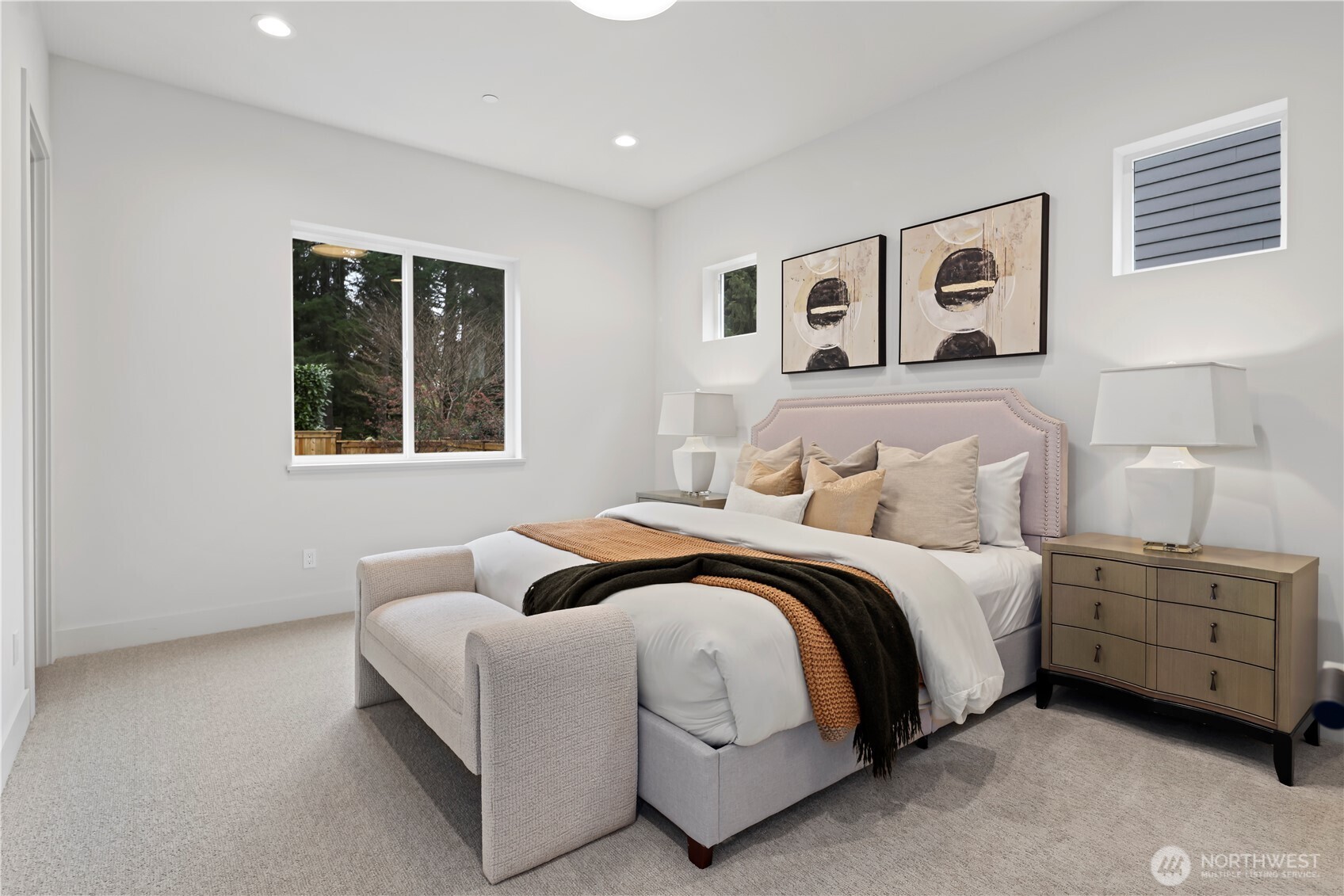 Private main-level guest ensuite with serene outlook to the back yard. Generously sized walk-in closet accommodates extended visits by family and friends.