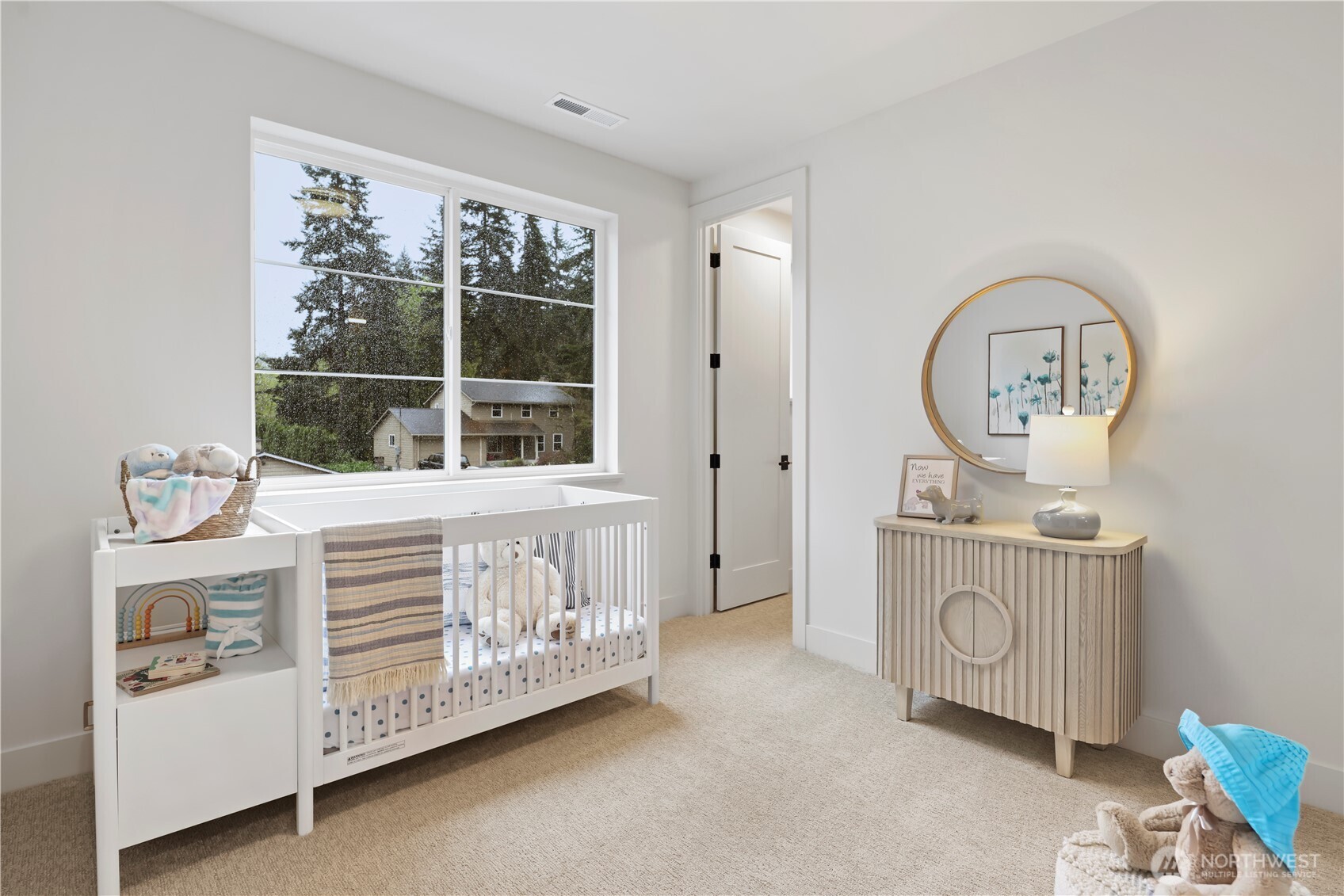 Sweet ensuite nursery, bedroom, or exercise room with large window + walk-in closet.