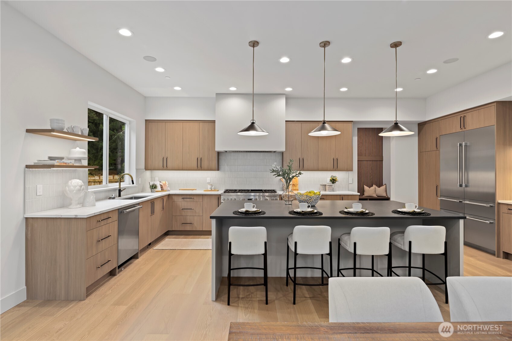 Seamless open-concept living with spacious informal dining, entertainer’s island and clean modern finishes.