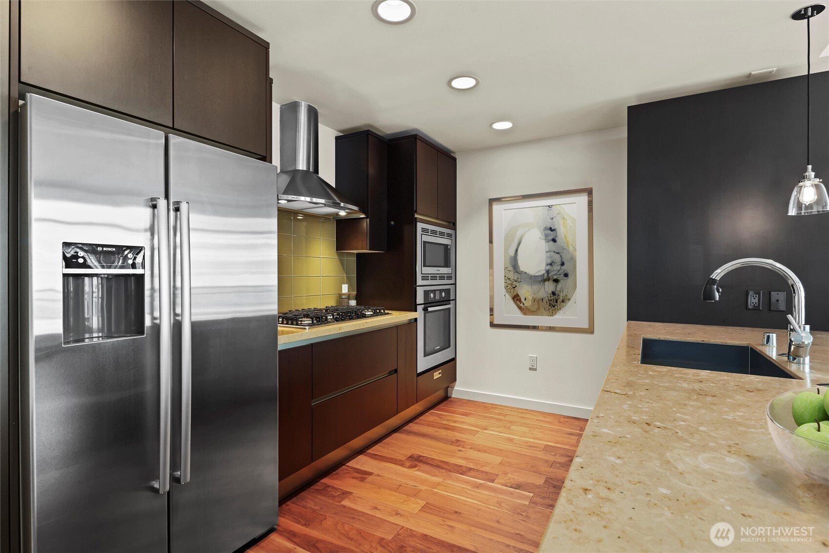 Chef's kitchen with upgraded Bosch gas appliances and custom SieMatic cabinetry.