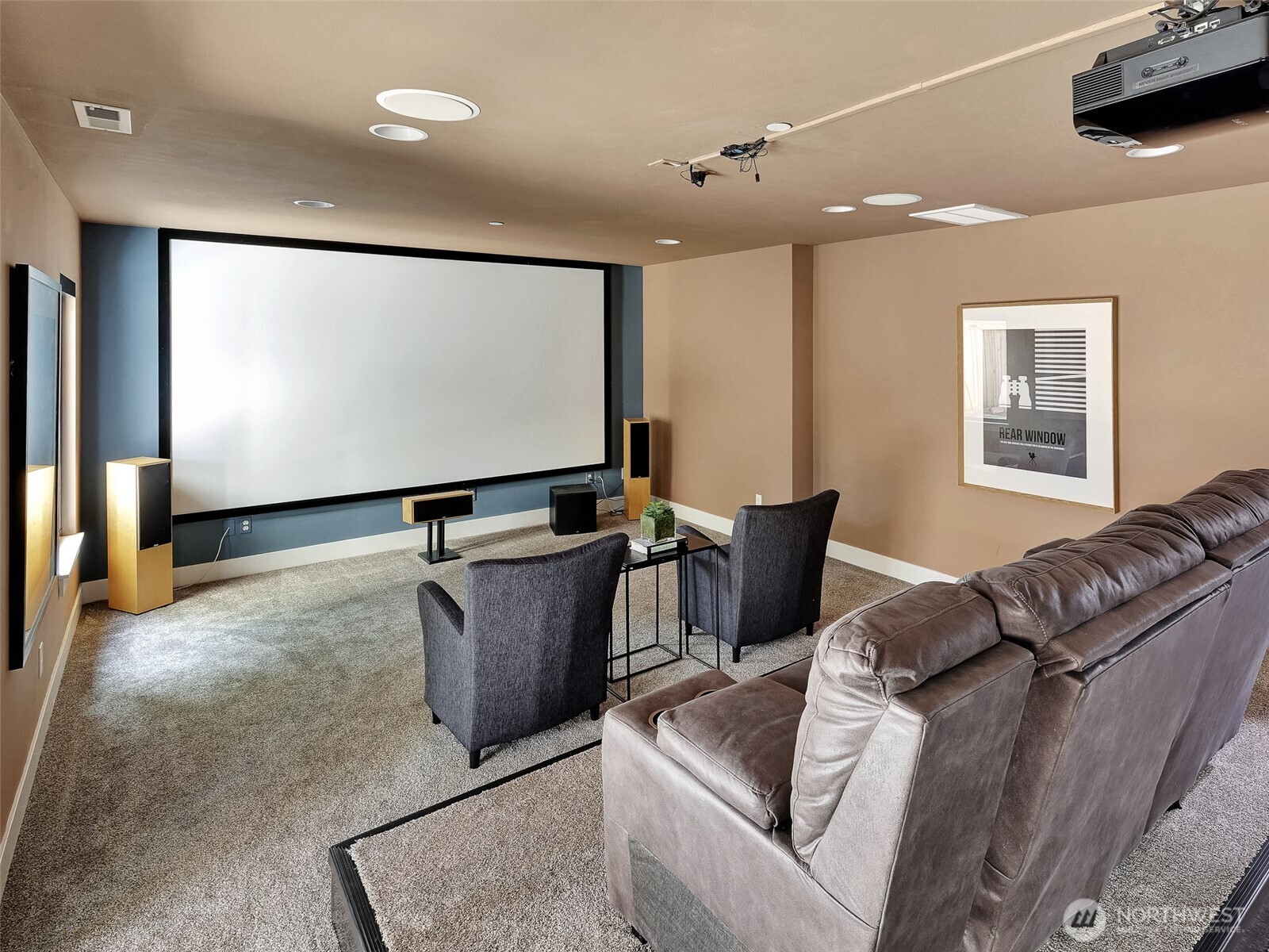 Fully equipped theater room with 150” screen and immersive 7.1 surround sound