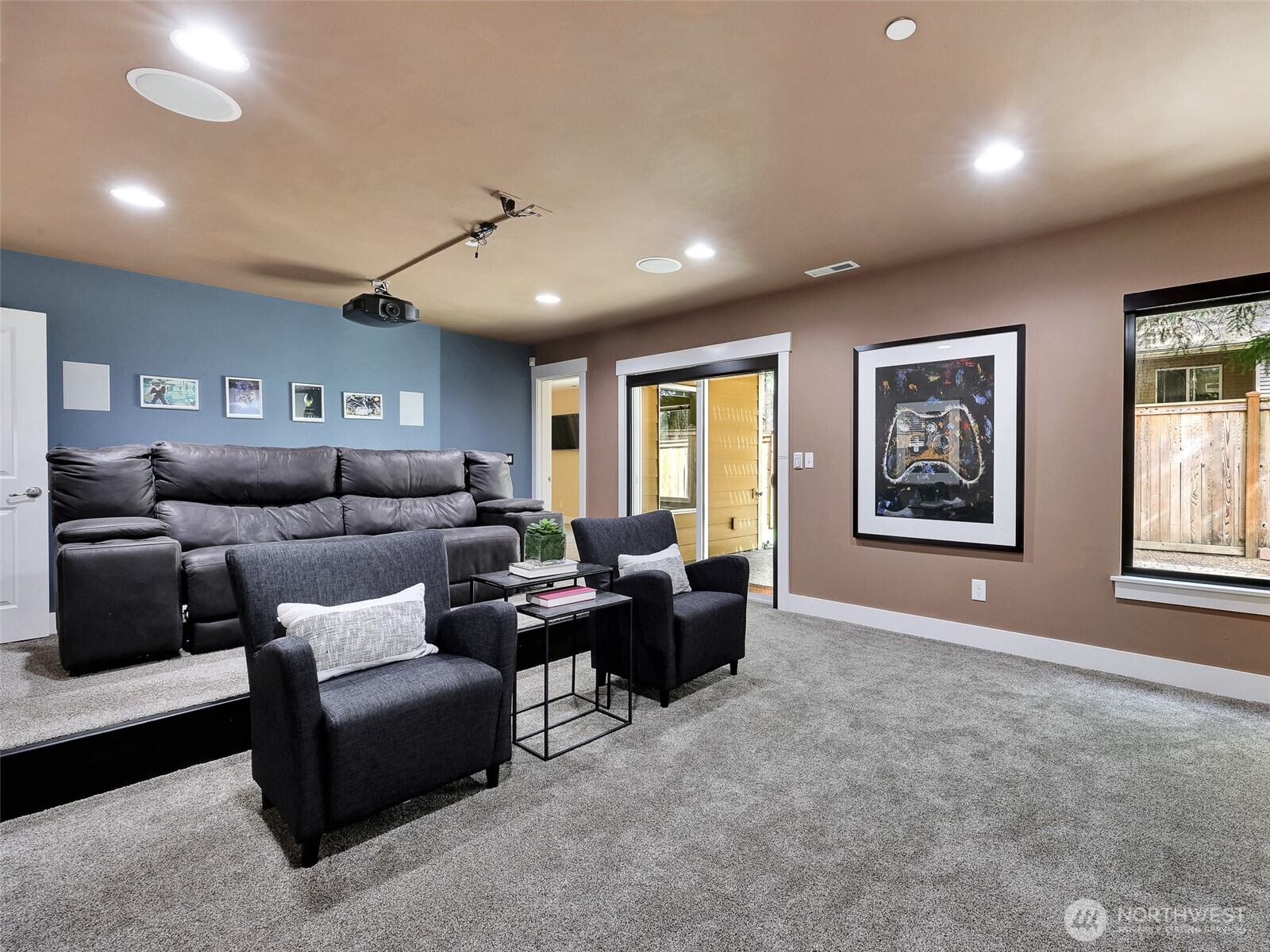 Fully equipped theater room with 150” screen and immersive 7.1 surround sound