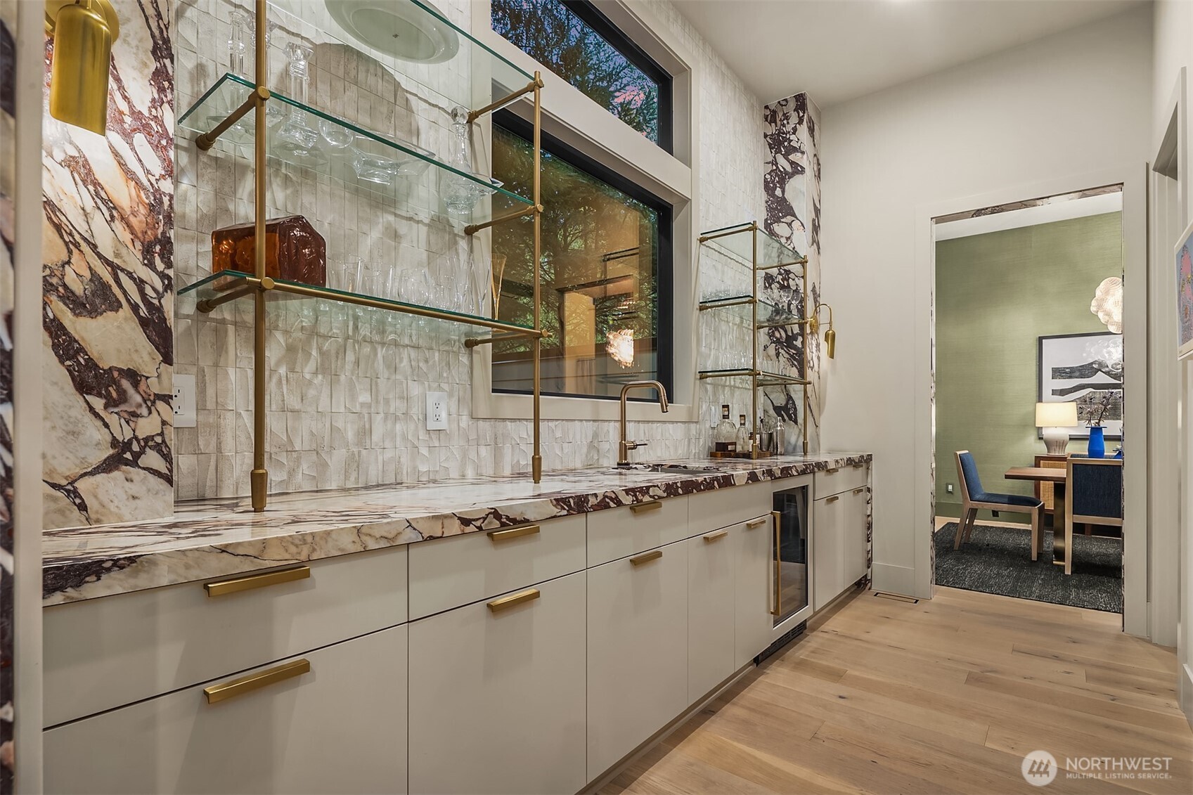 Calacatta Viola Premium slab, textured tile backsplash, and a beverage center — how stunning is this? The butler's pantry that makes every dinner party feel like it was catered.