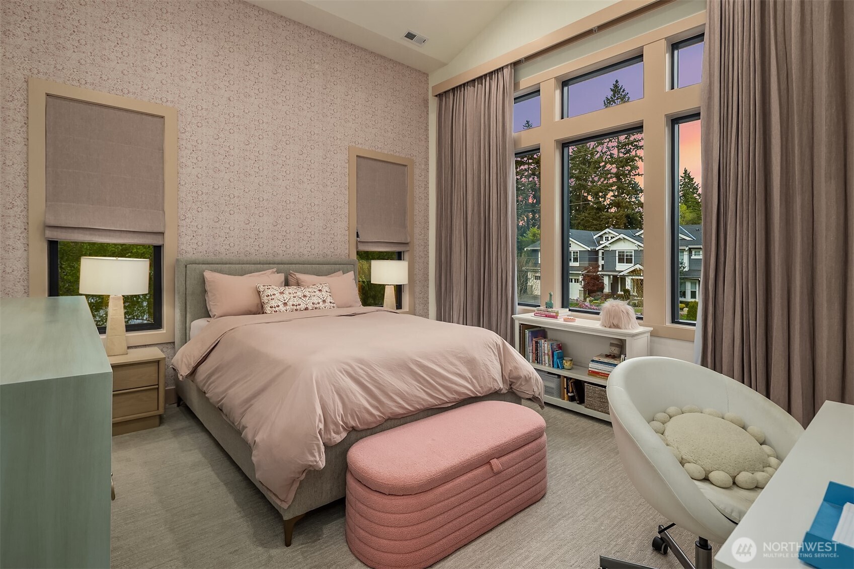 Penny Morrison Nankeen Pink wallcovering, vaulted ceilings, and a wall of windows overlooking a sunset sky. The room with just the right amount of whimsy.