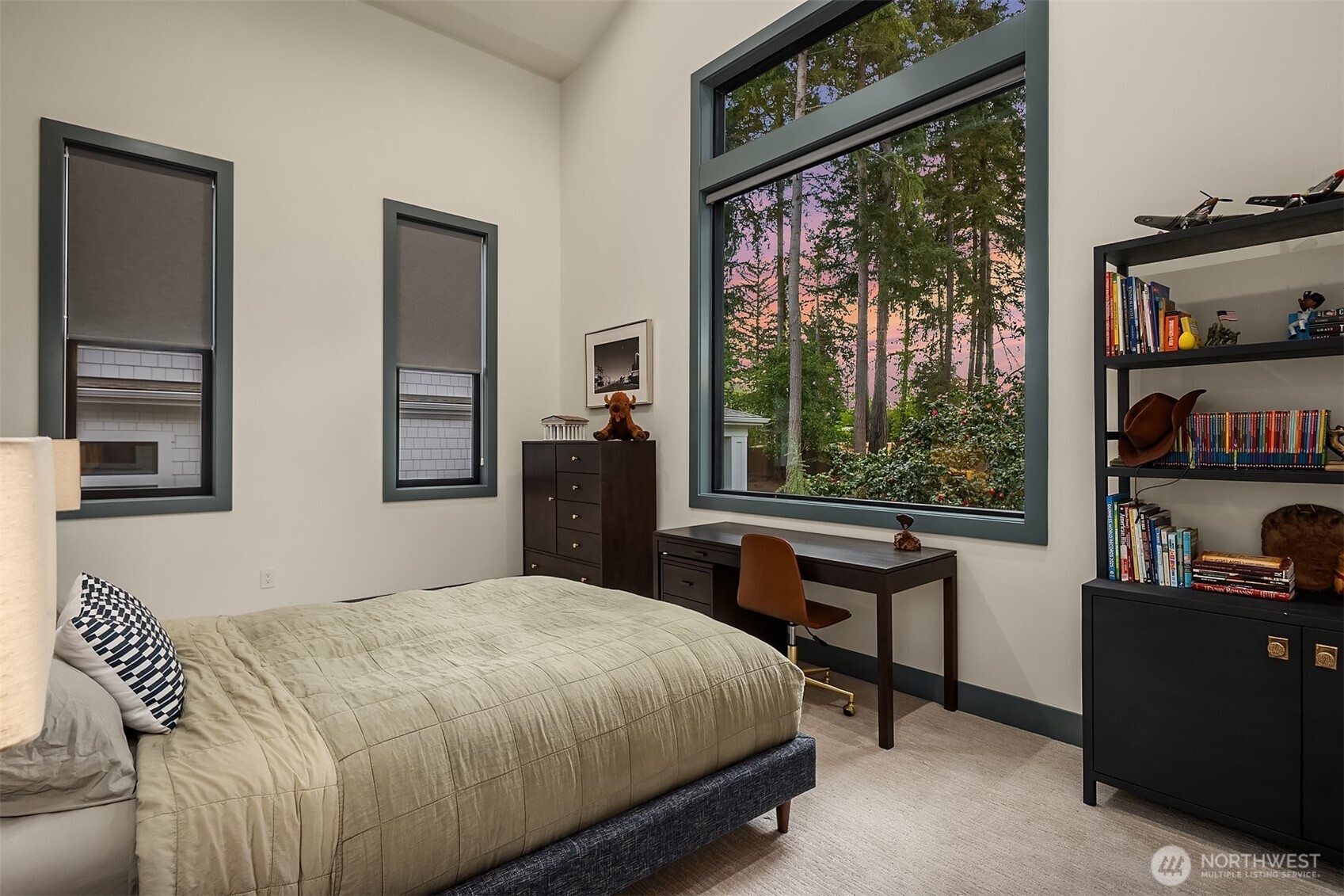 Towering evergreens, a sunset sky, and a room that makes bedtime a little easier to negotiate.