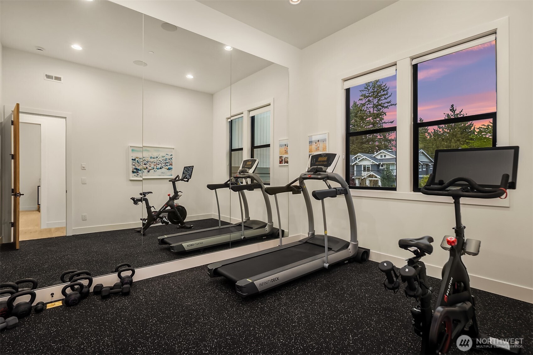 A dedicated gym with rubber flooring, floor-to-ceiling mirrors, and enough space to actually break a sweat. Skip the membership — this one's already yours.