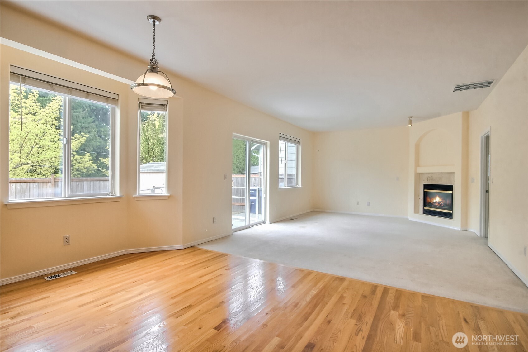 Glamming Hardwood floors at nook and kitchen. Family room view - large slider to backyard and there is ramp help to in/out