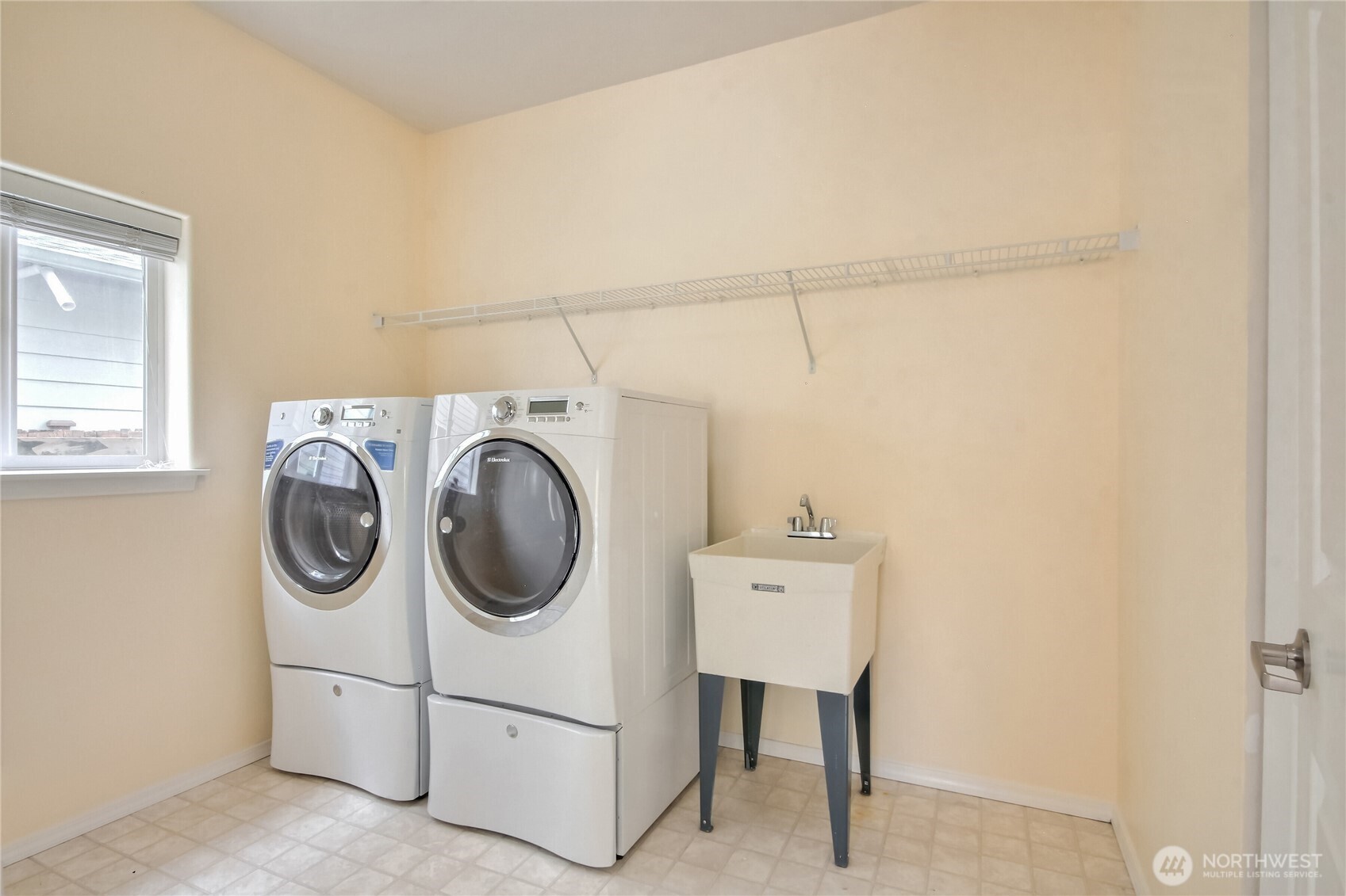 Spacious Laundry room has sink