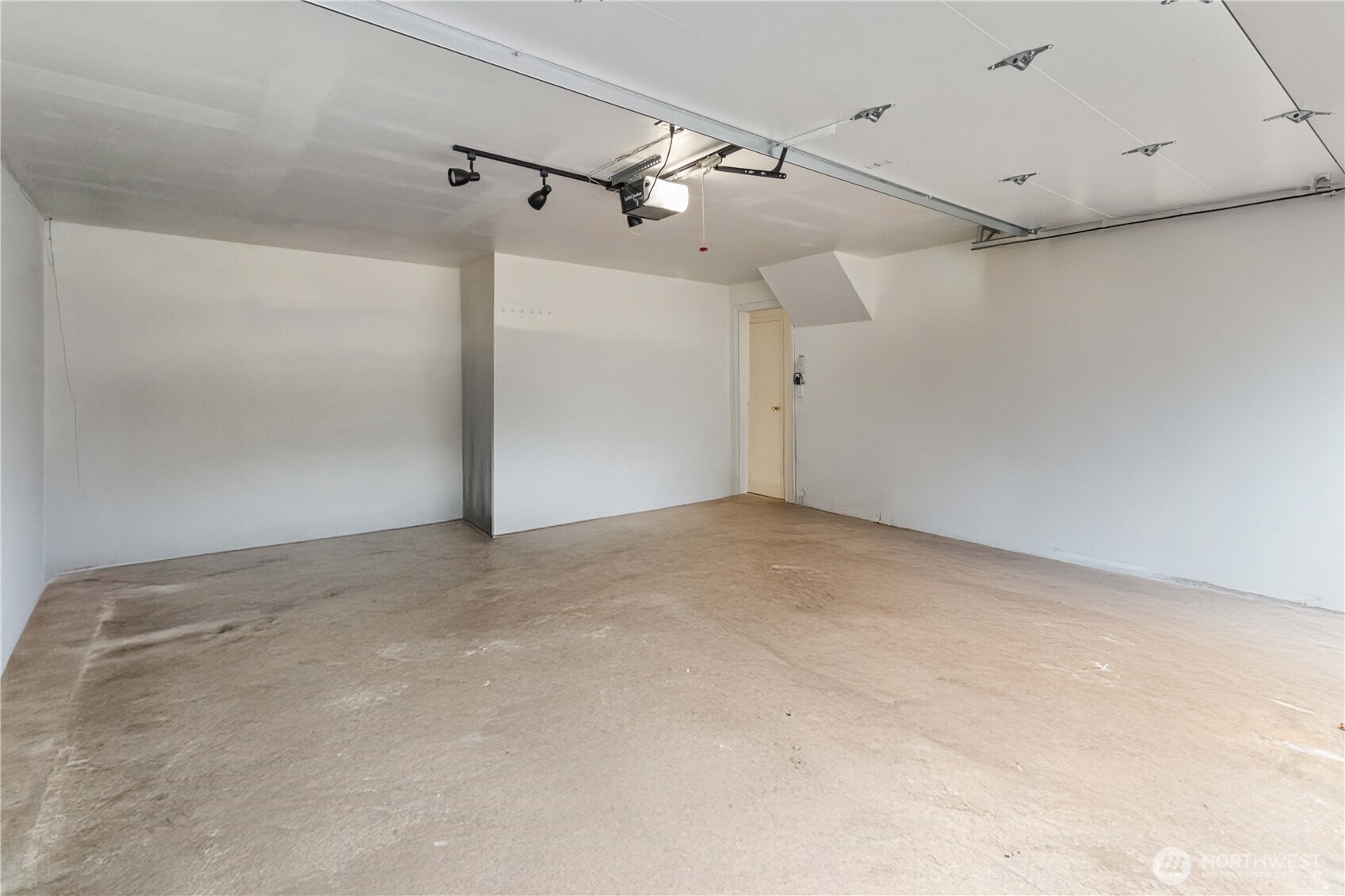 Two car garage with ample storage space