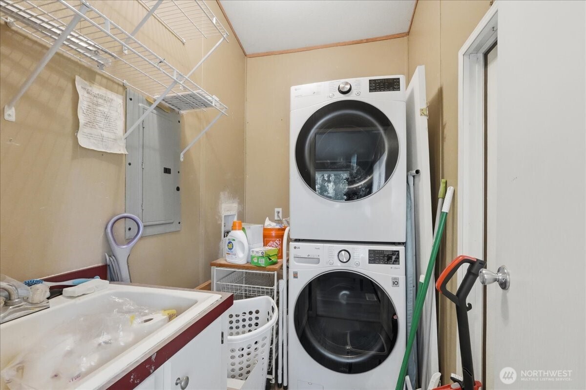 Utility/mud room with utility sink and back door entry from back yard. (Washer and dryer do not convey.)