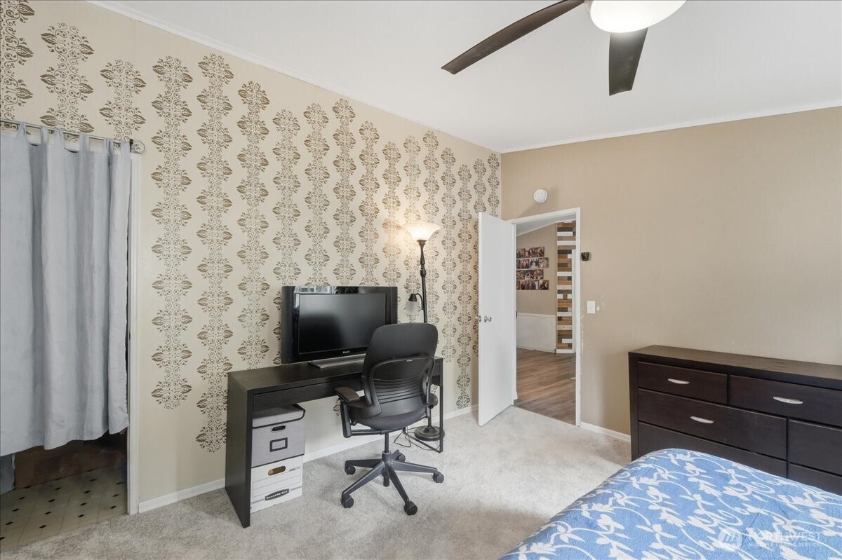 Another view of the primary bedroom with walking closet on the left.