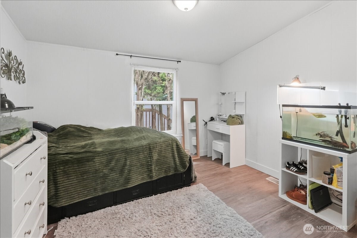 Den/office with double door entry is currently being used as a bedroom.