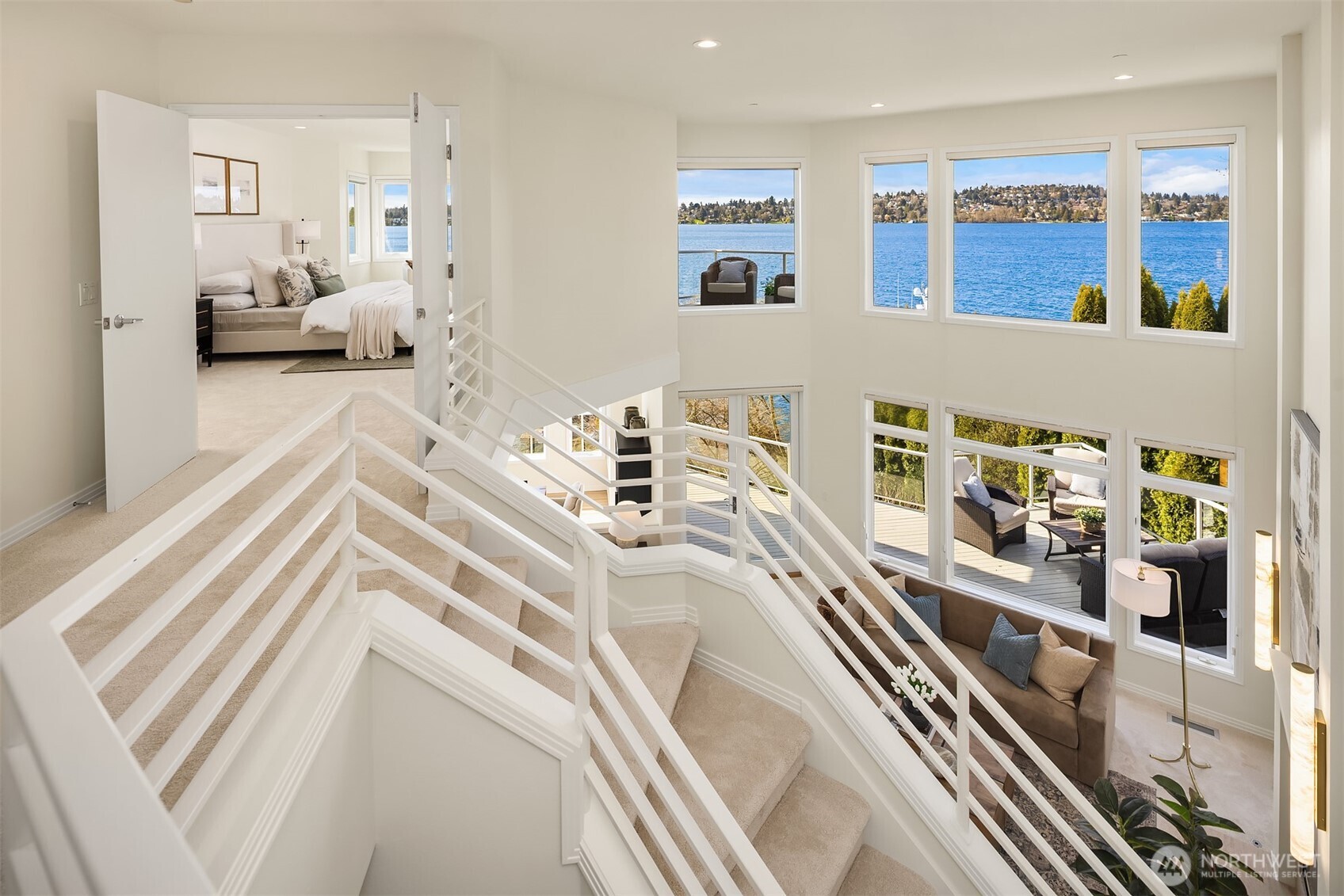 Thoughtful architecture ensures the lake remains in sight at every turn—even from the transitions between levels.