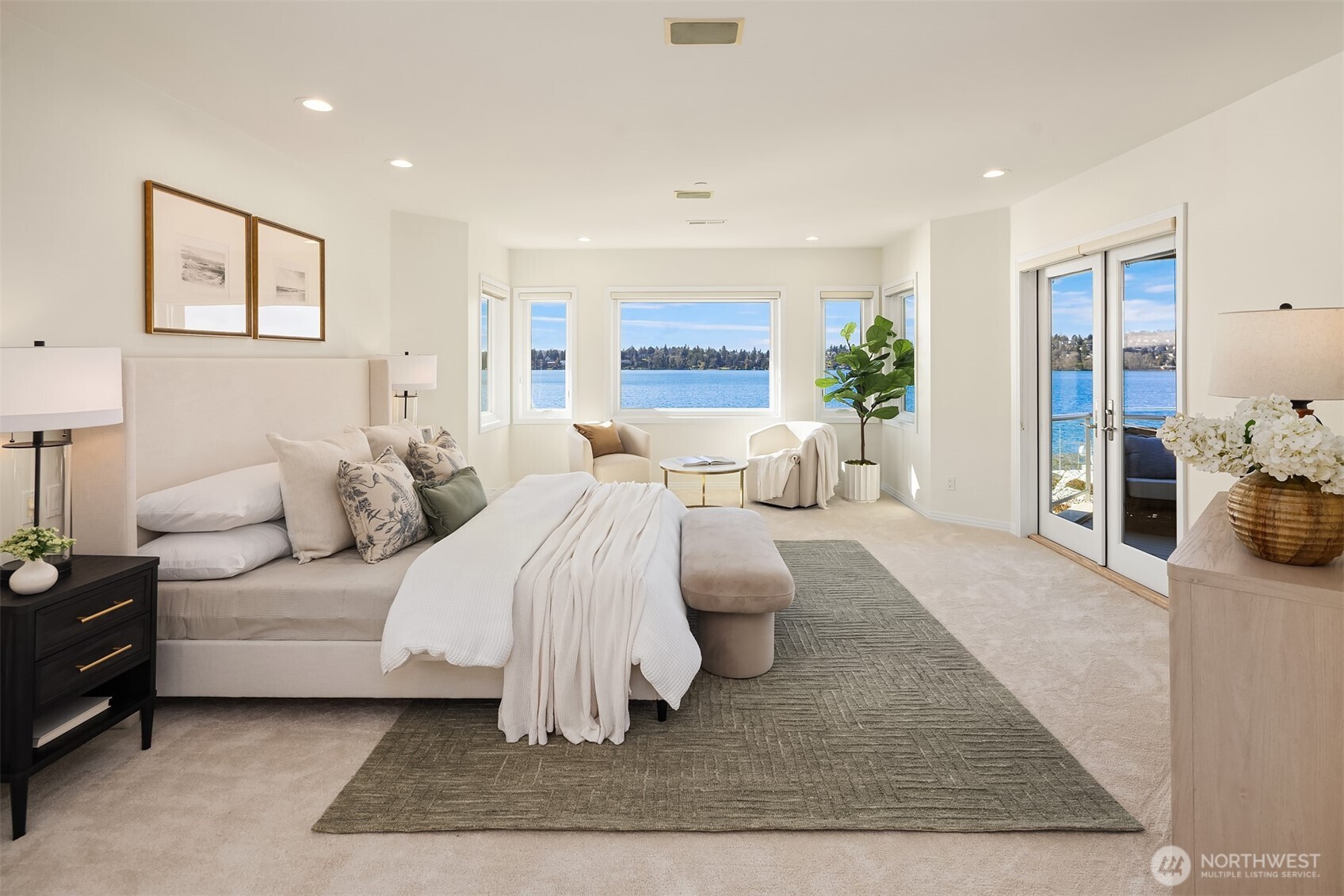 The primary suite: a spacious lakeside sanctuary featuring a private balcony for quiet morning coffee and starlit evenings.