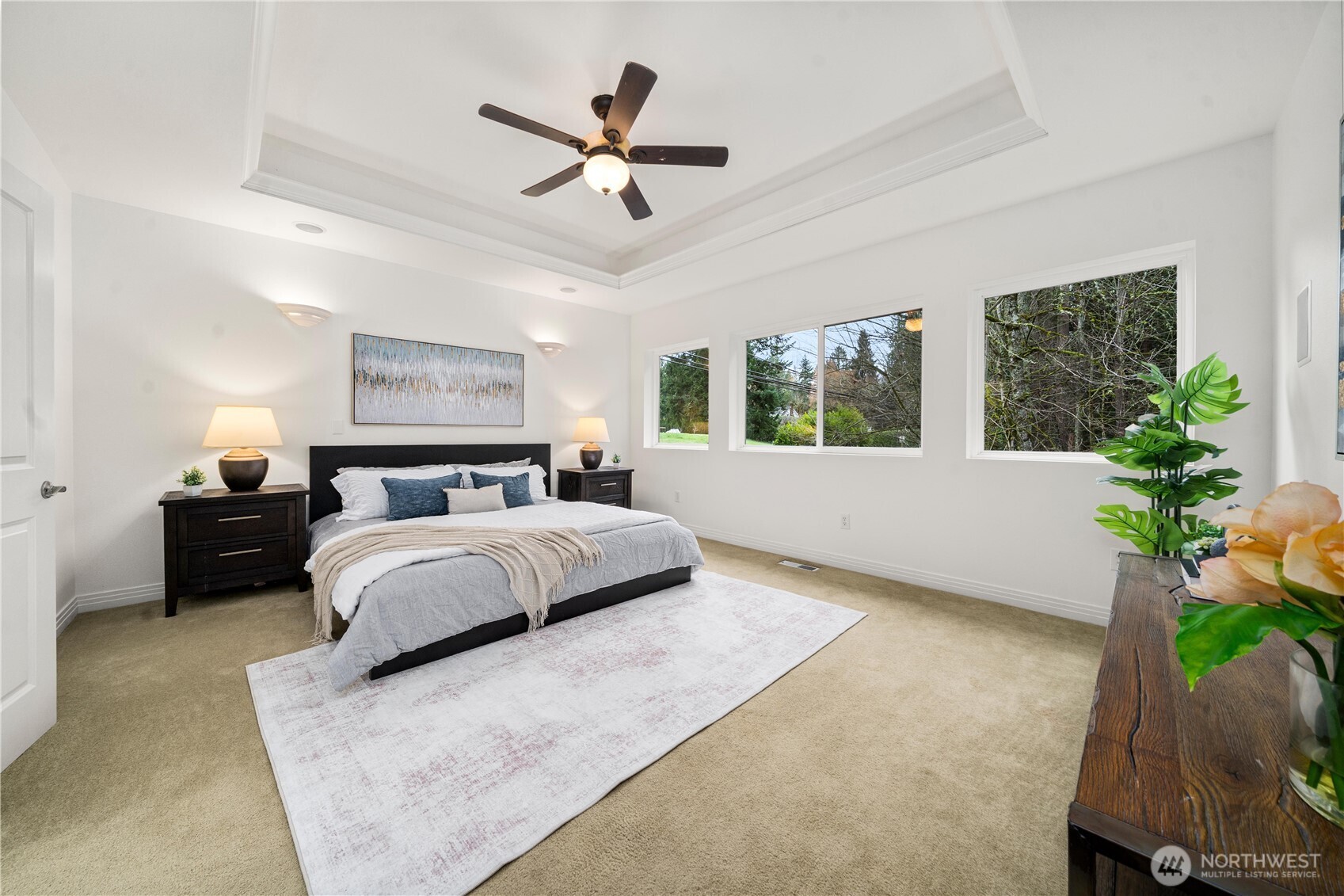 The primary suite offers a walk-in closet & a newly updated spa-inspired five-piece bath.