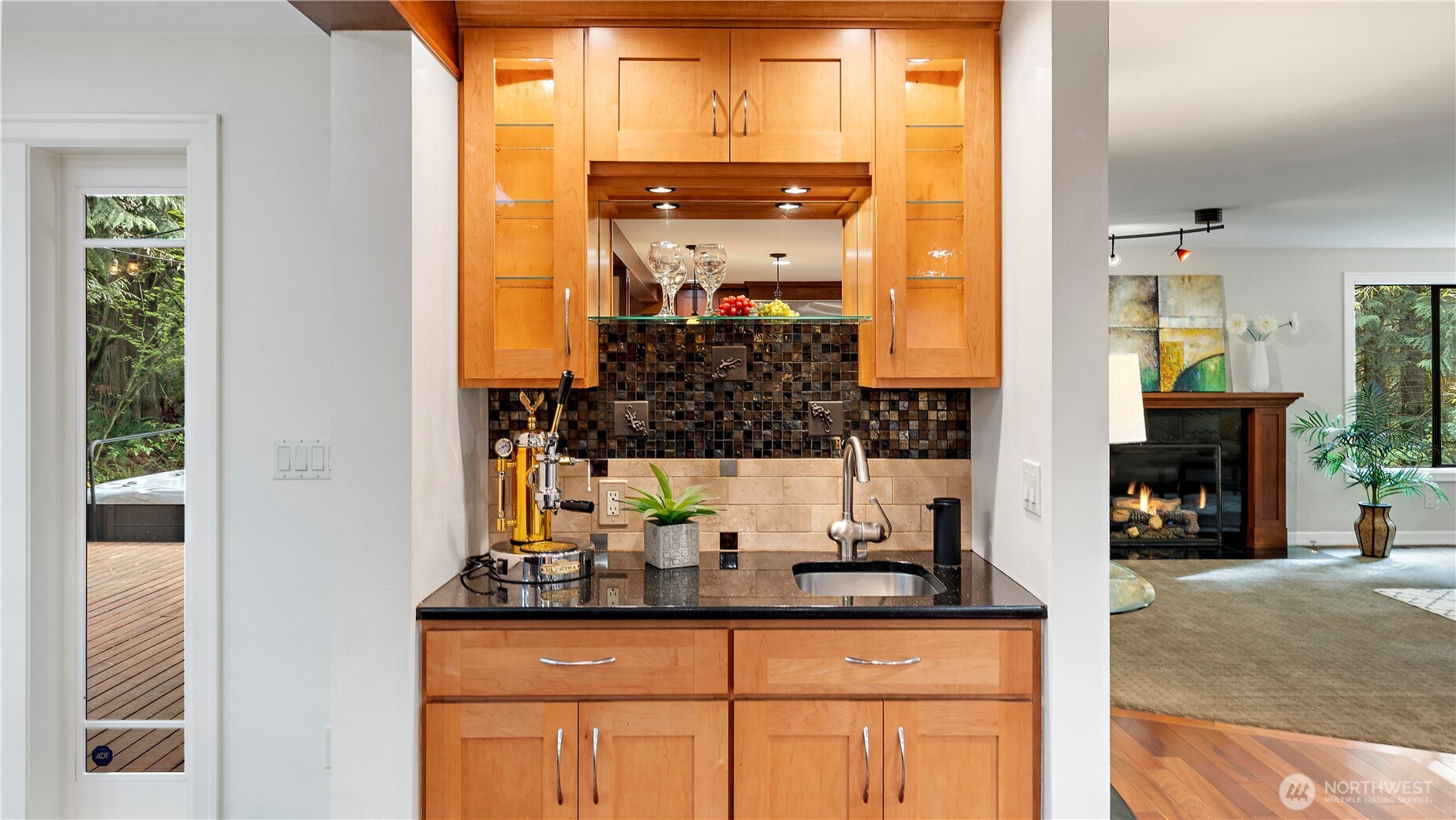 The maple cabinetry continues the Norsk interplay of contrasting natural materials, adding richness and refinement to the design.