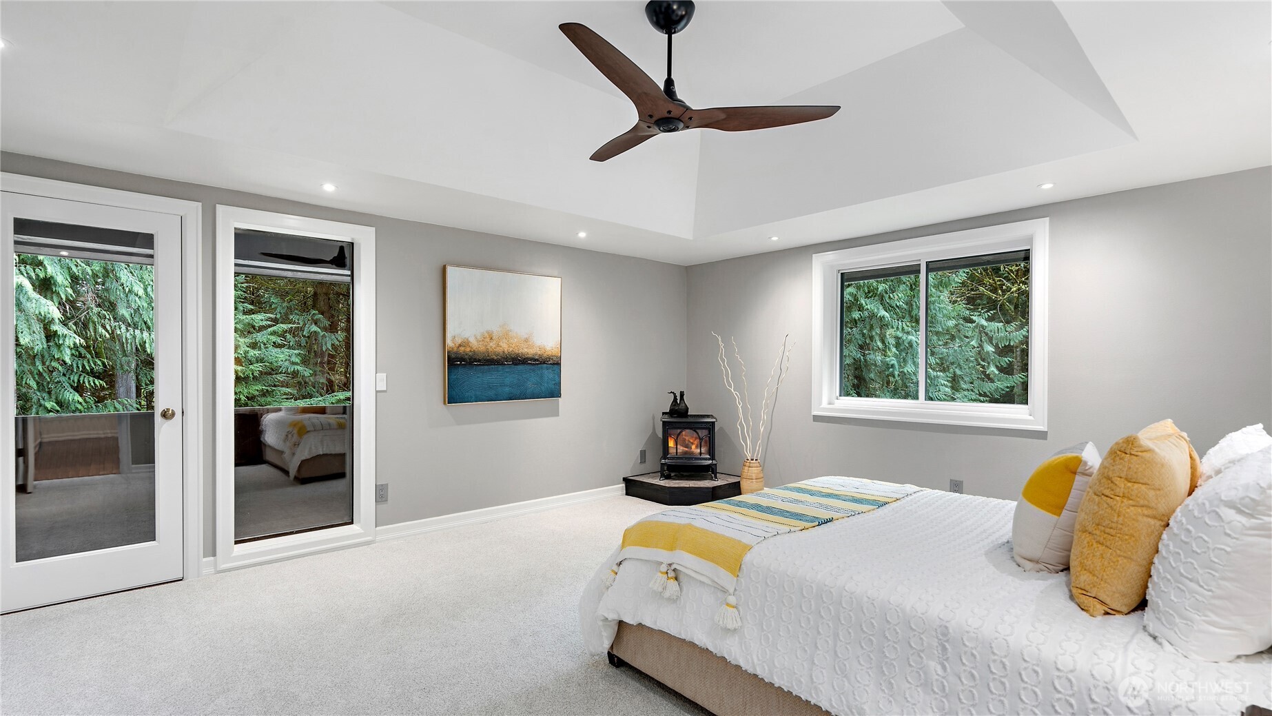 The ensuite was just remodeled, and the sliding walnut ripple glass door gives you a beautiful sense of what’s to come. Let’s step inside.
