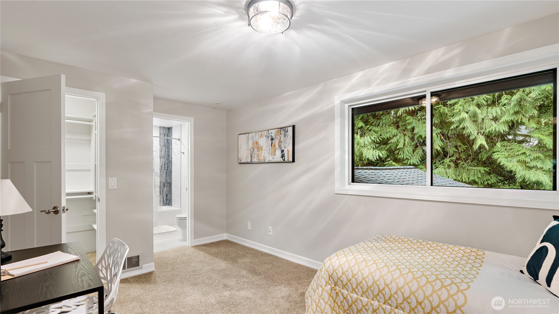 Between the two bedrooms, you’ll find a nicely updated Jack and Jill bath with a large dual-sink vanity and plenty of room to get ready without crowding each other. It’s such a functional setup, and so well done.