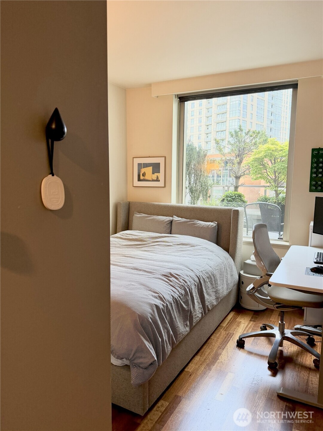 Bedroom with ample space, natural light, and serene atmosphere.