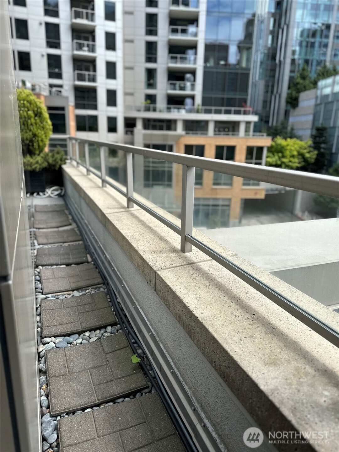 Expansive terrace walkway with city views and ample room to relax.
