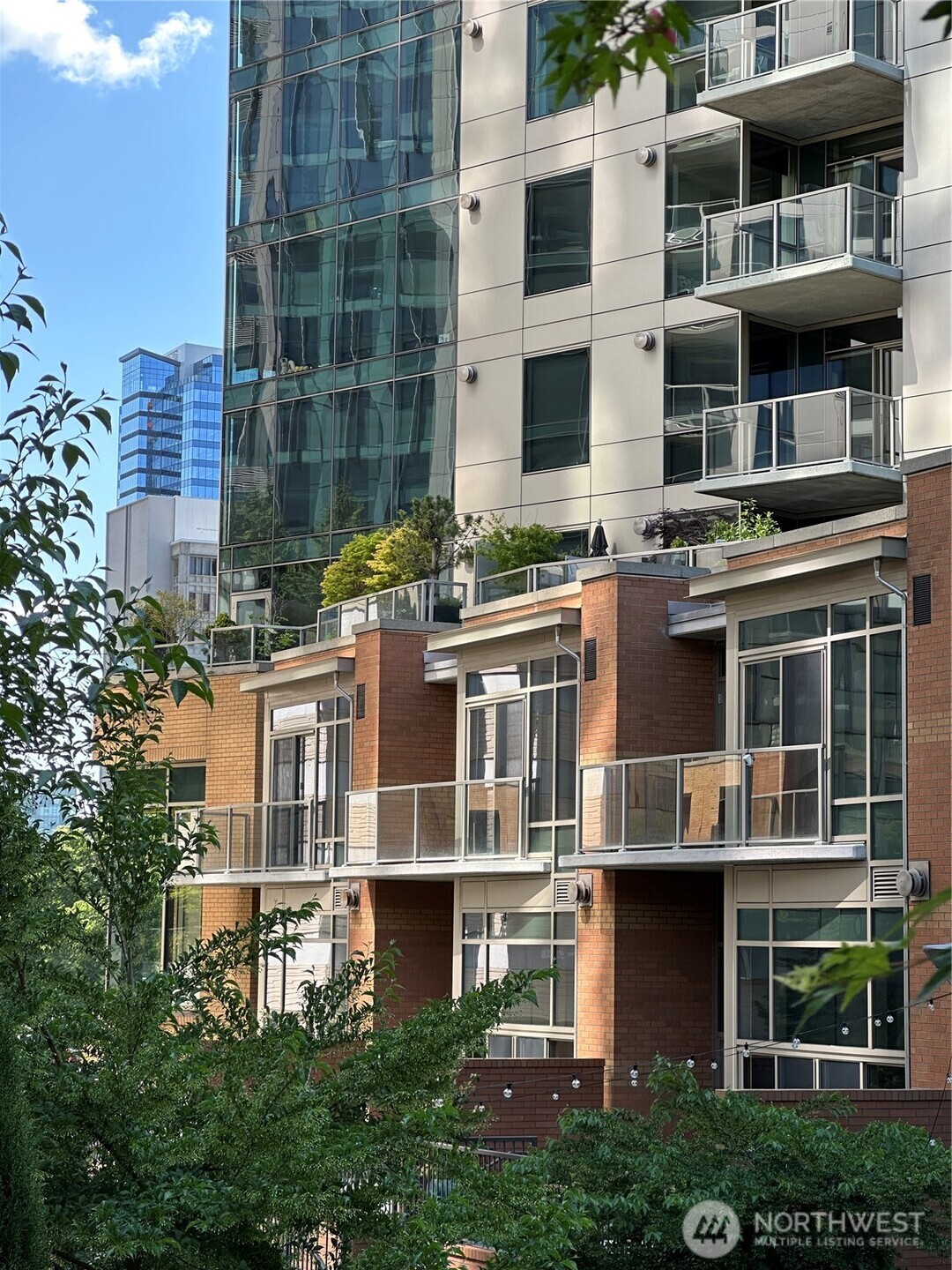 Architecturally appealing exterior with mixed-use design and street-level presence.