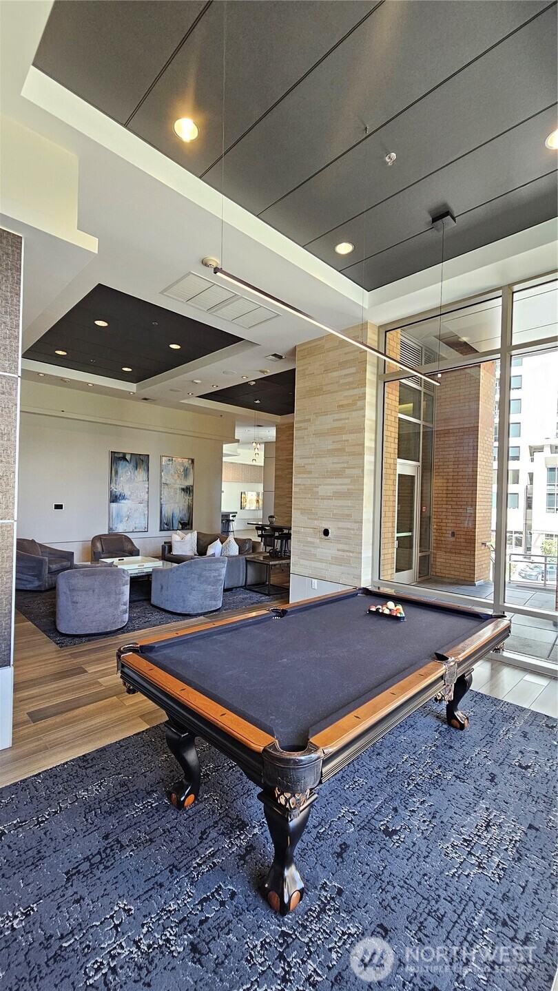 Recreation room with billiards and lounge space.