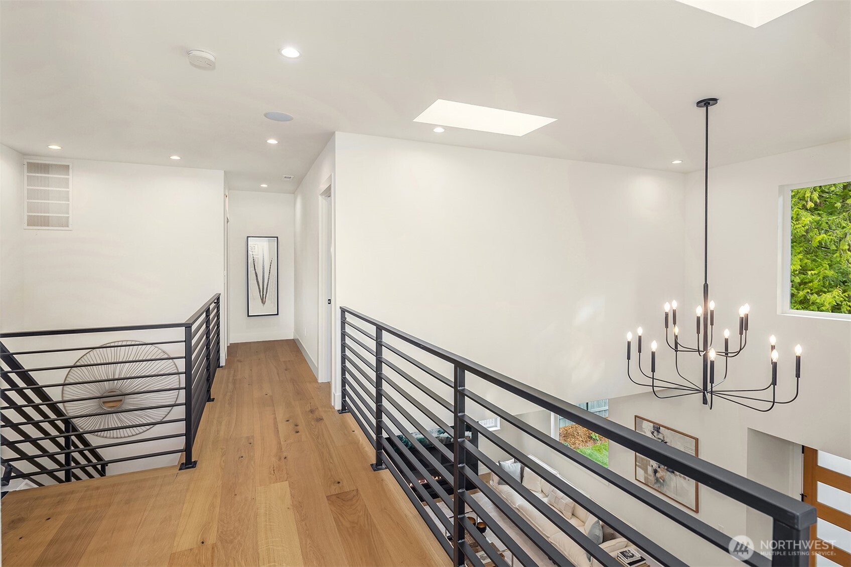 Second story landing overlooks the entry. Large skylight fill the space with natural light