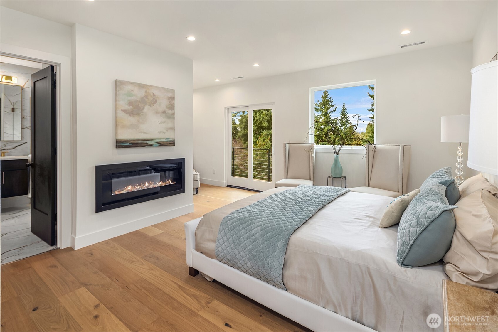 Truly luxurious primary suite with fireplace and private patio access