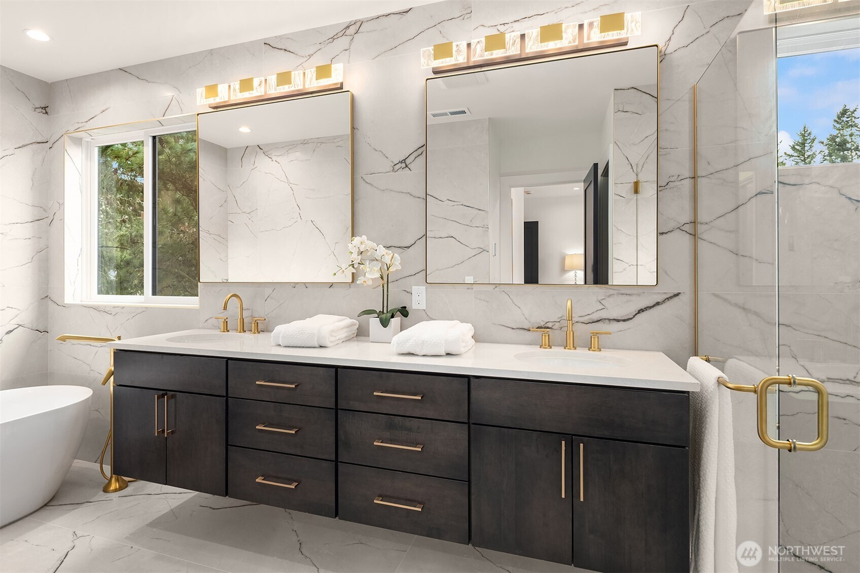 Gorgeous primary bath with floor to ceiling large format tile