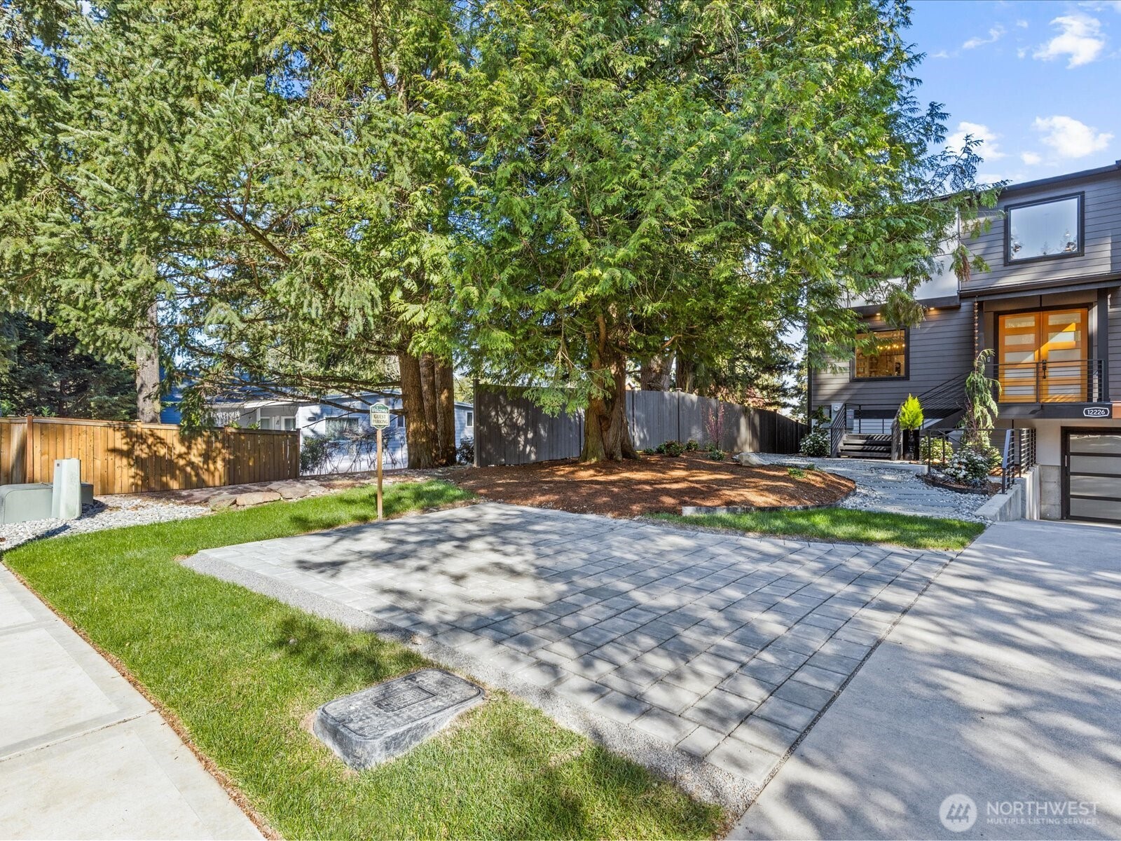 Convenient driveway turnaround or dedicated parking space for the lower level unit. Large, heated driveway easily accommodates up to 6 vehicles