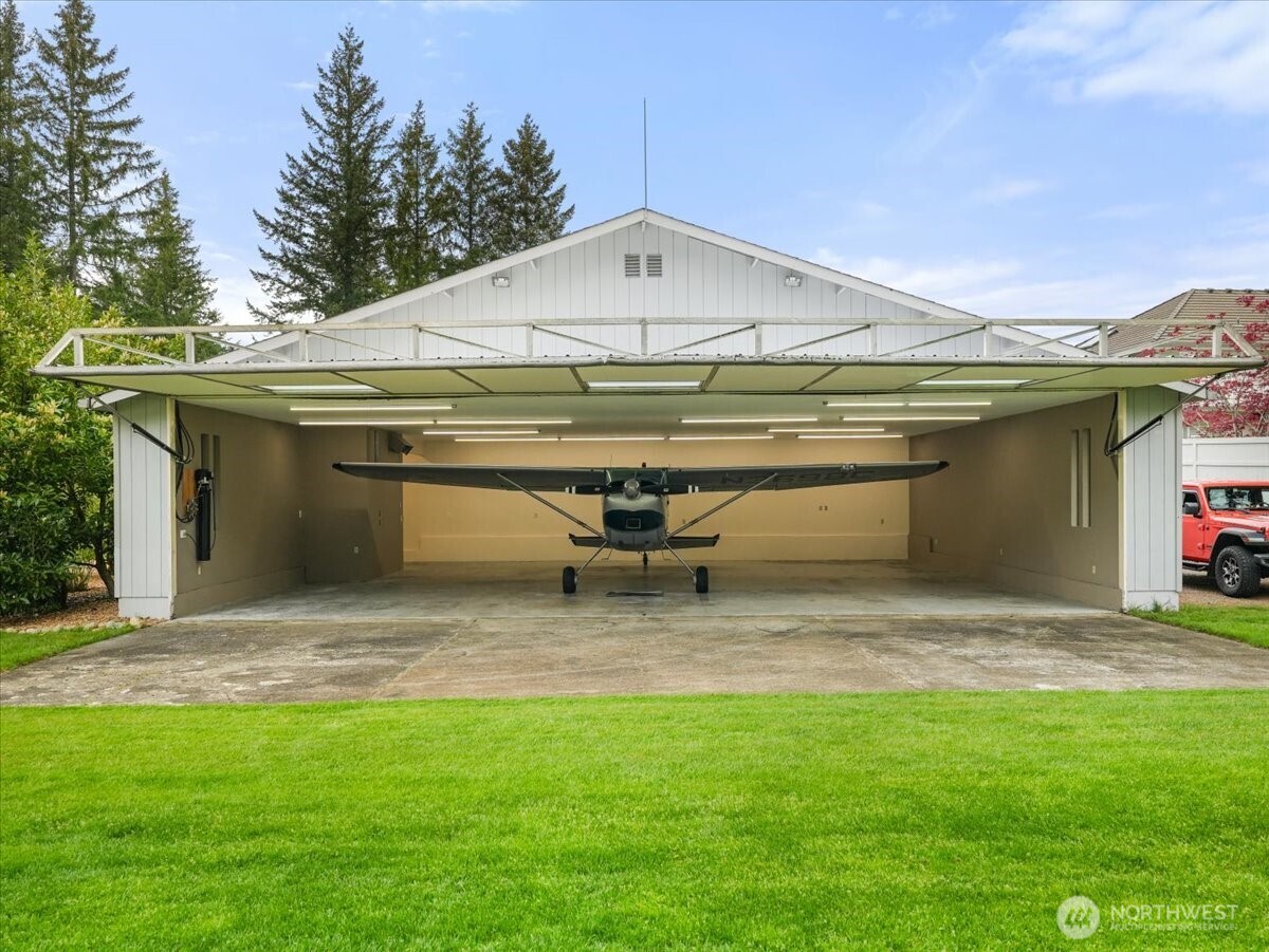 Wow! Your own hangar for your aircraft and much more. Located off the lush, grassy Taxiway H.