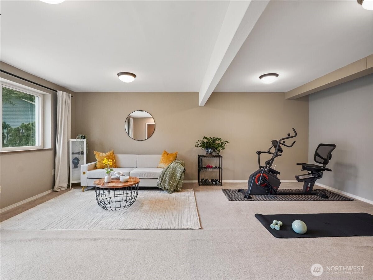 The lower level rec room has plenty of space for games and workout equipment.