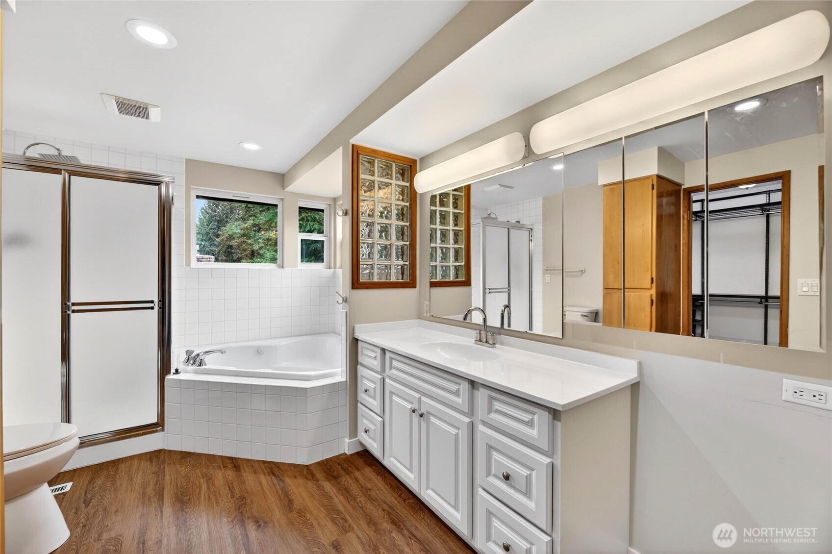 Remodeled PRIMARY BATHROOM – 2026  New vanity with medicine cabinet / Recessed lighting  8’ tall French doors to bathroom