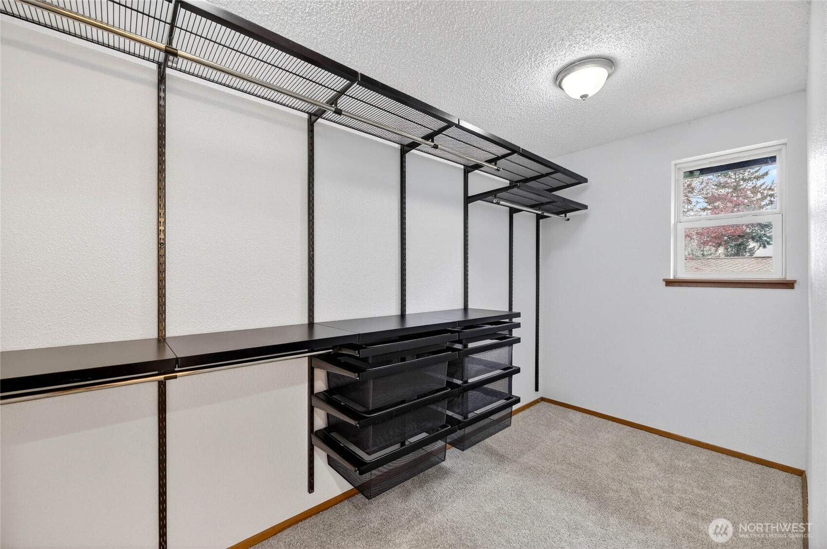 Walk-in CLOSET with built-in shelves, pull out drawers & lots of hanging space  Window in closet with views of side yard, opens for fresh air, and gives natural light