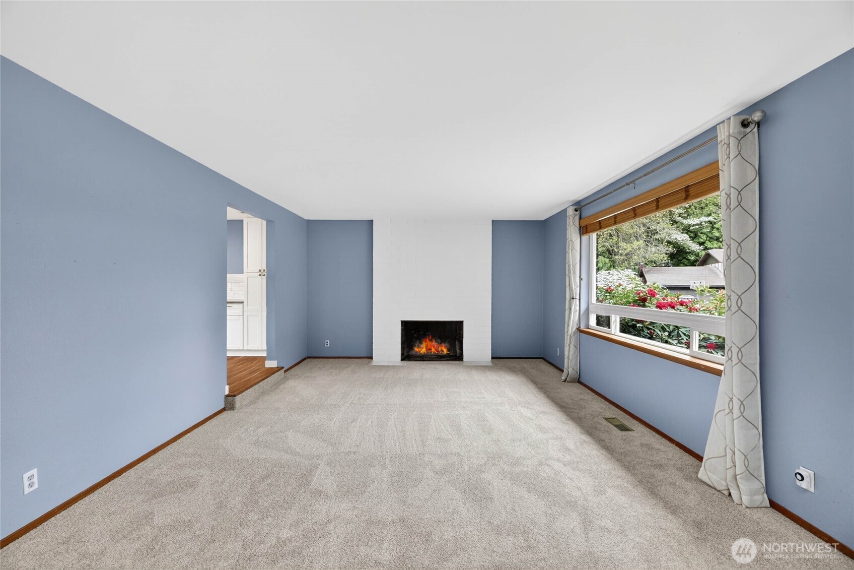 Floor to ceiling brick faced wood burning fireplace  Chimney flue was water repellent sprayed in 2025  2nd coat to be completed summer 2026, at no cost to new owner