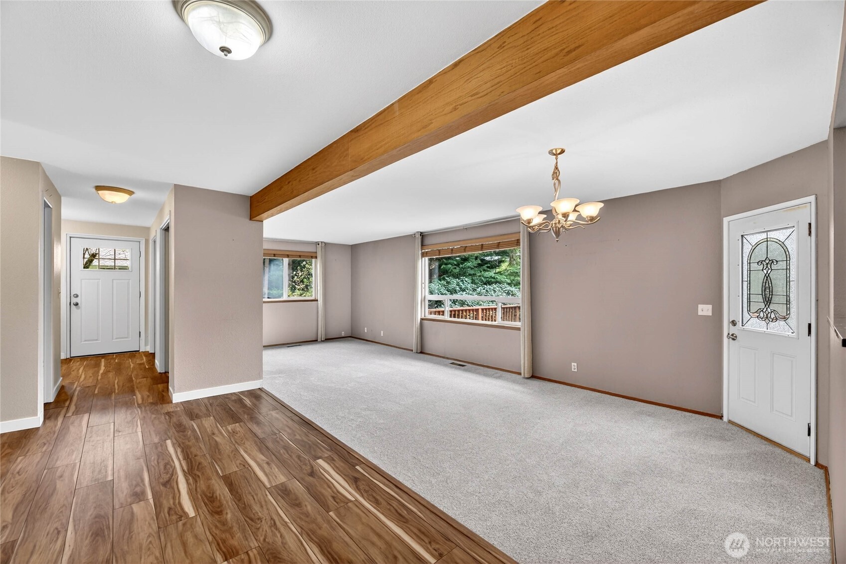 DINING ROOM   Door leads to 28’ view deck     Sunken FAMILY ROOM  Exposed ceiling beam  Picture window wall with wood blinds and curtains