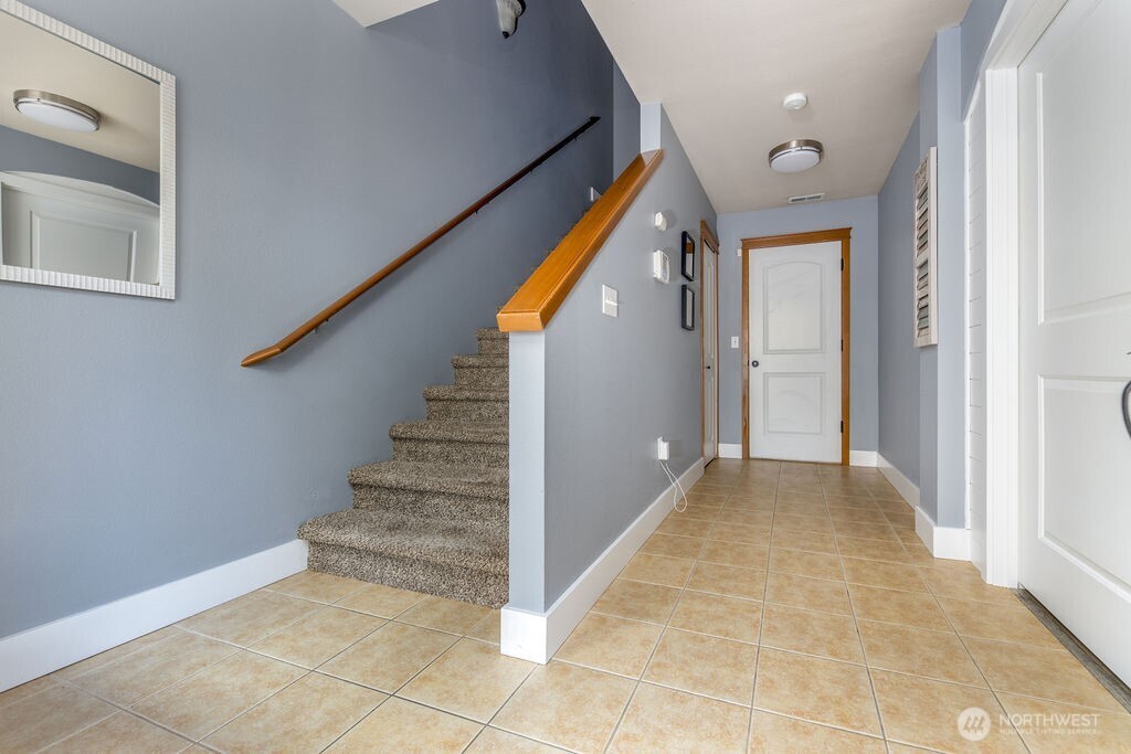 Entry, hallway to garage. Ground floor bedroom on the right.