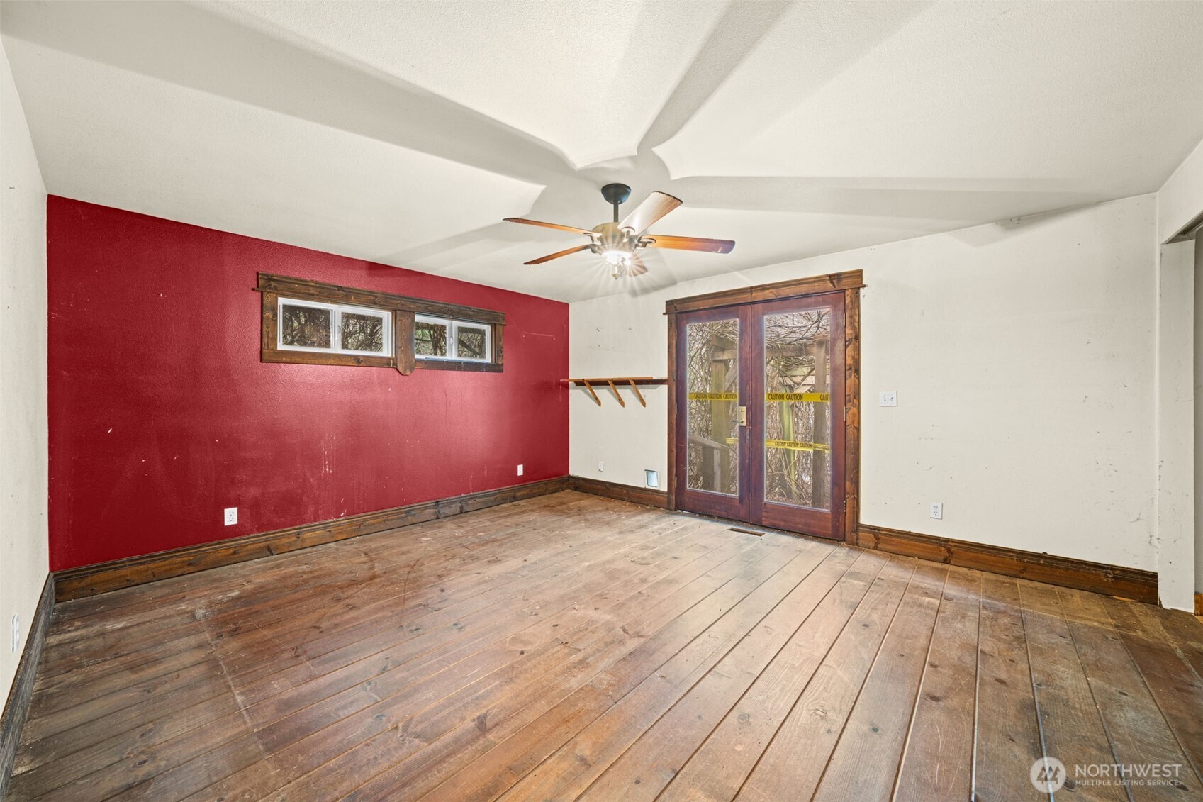 French doors leading to the outdoors, bringing in natural light and potential for indoor-outdoor living. A solid foundation to create a relaxing retreat.