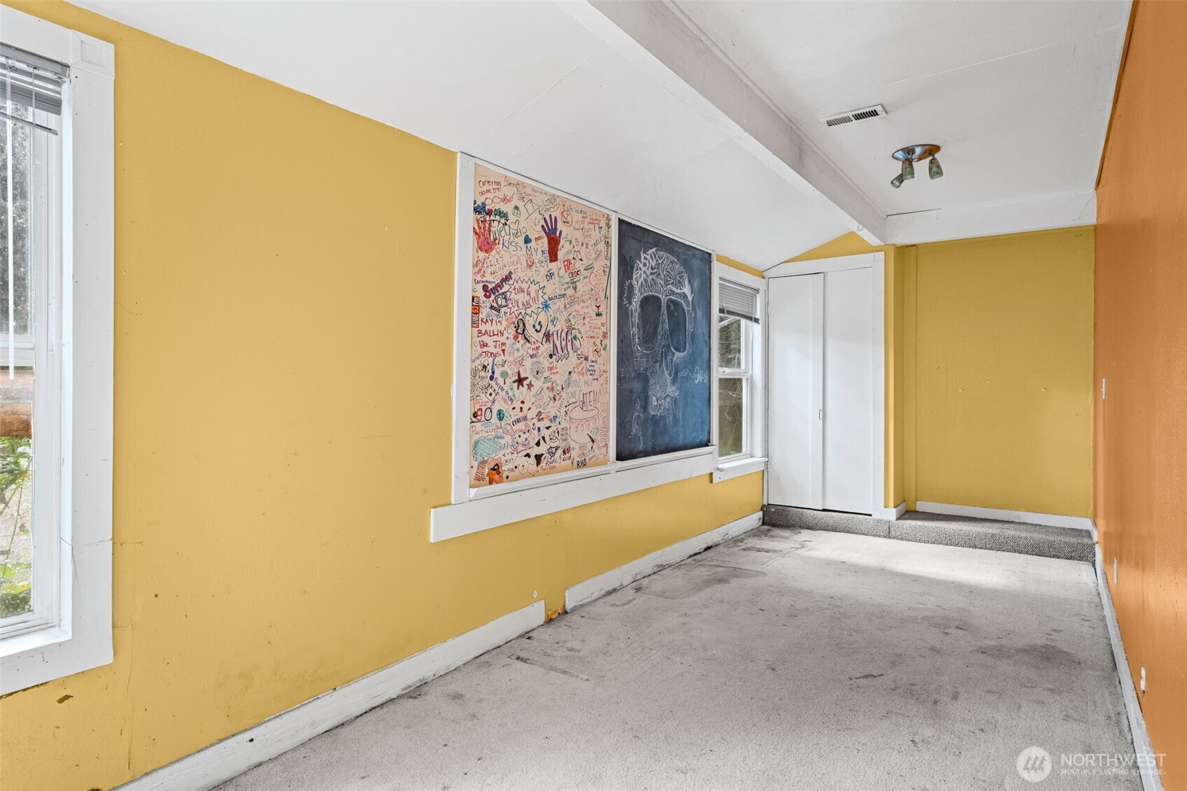 Flexible bonus room with natural light, ideal for office, studio, or additional living space. Ready for updates to suit a variety of needs.