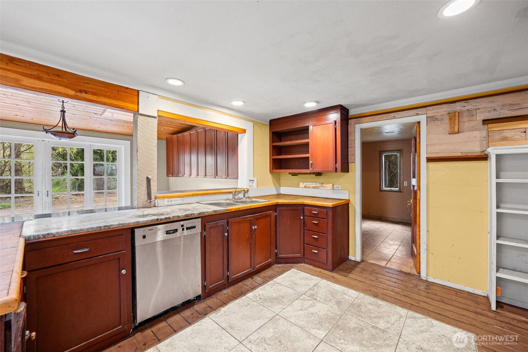 Spacious kitchen layout with direct access to additional rooms and flexible design options. Great opportunity to create a modern, open-concept cooking and gathering space.