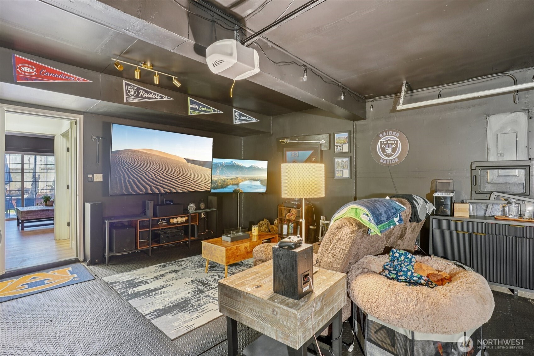 2-car garage currently styled as a bonus hangout space, perfect for hobbies, game day, or extra storage.