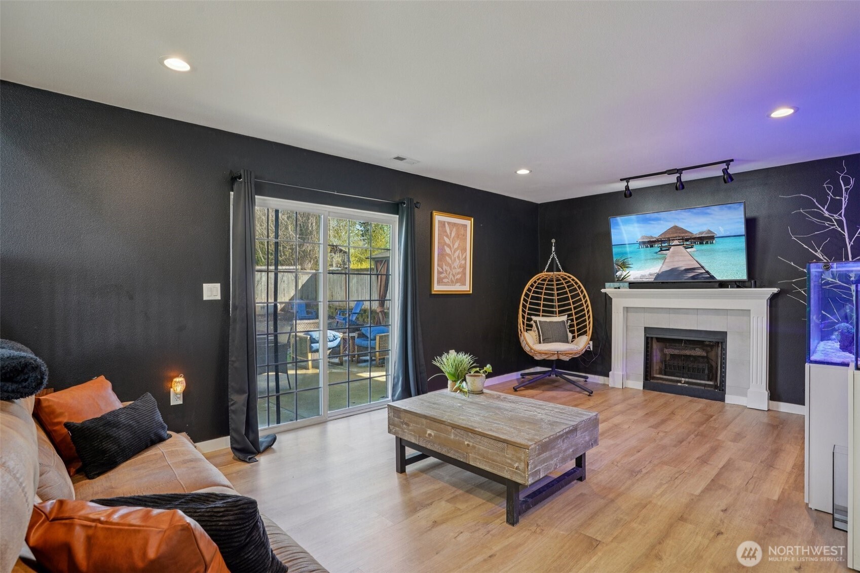 Lower level family/living room with entrance to outside patio