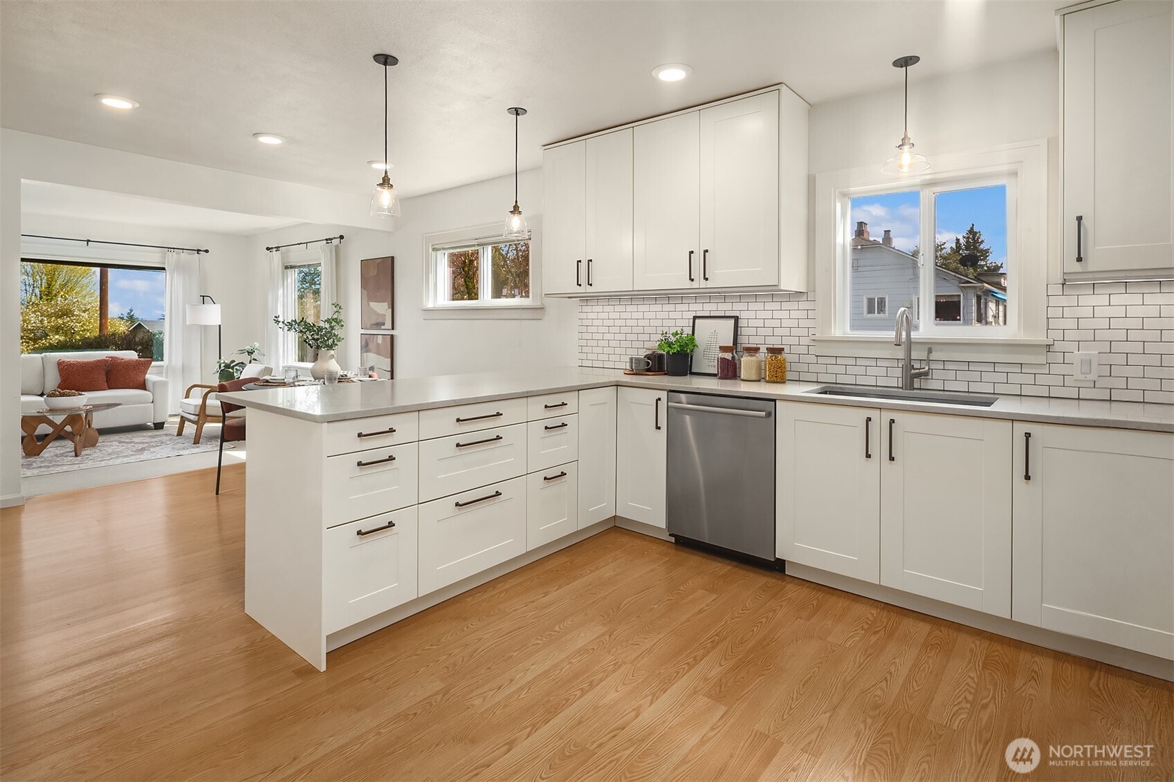 Remodeled kitchen with large island that opens to main living space.