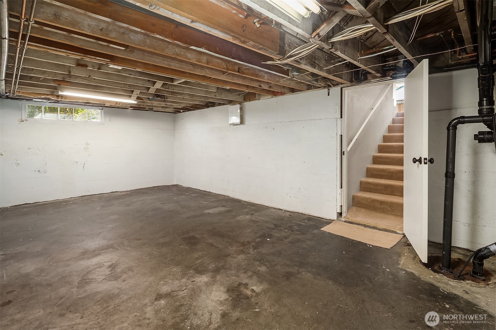 Lower level with bedroom/bathroom & ample room for storage.